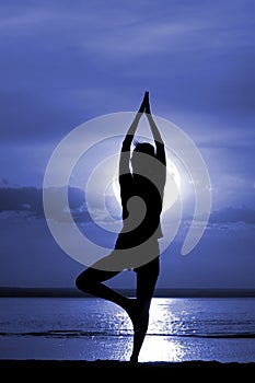 Silhouette of the women meditate