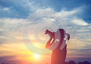 Silhouette women Nature photographer with digital camera on the mountain and lake