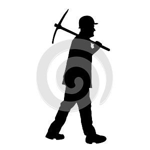 silhouette of a worker holding his mattock tool.