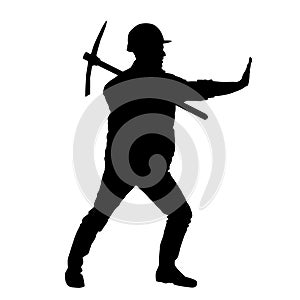 silhouette of a worker swinging his mattock tool.