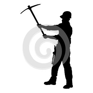 silhouette of a worker swinging his mattock tool.