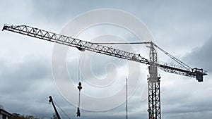Silhouette of a working tower crane UK