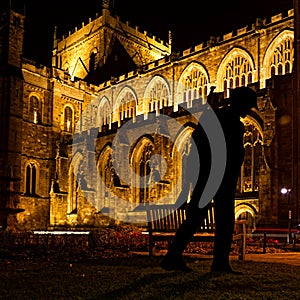 Silhouette of WWI solider outside an illuminated Ripon Cathedral