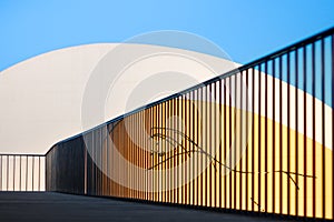 Silhouette of the "Garota" in the Niemeyer Center of AvilÃÂ©s seen from the pedestrian walkway "La Grapa" photo