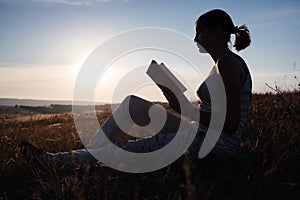 Silhouette of a young beautiful woman