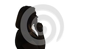 Silhouette of young black woman thinking something