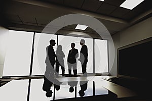 Silhouette of young business people in the office.