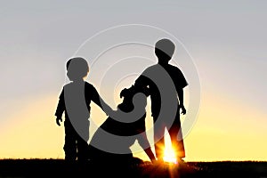 Silhouette of Young Children with Dog