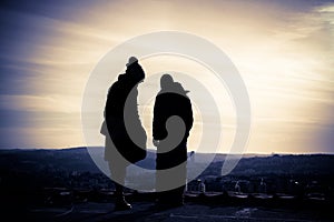 Silhouette of young couple at sunset