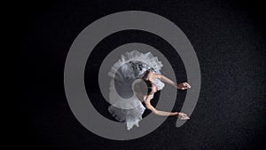 Silhouette of young elegant woman ballerina performs jump, stretching concept, ballet concept, top shot