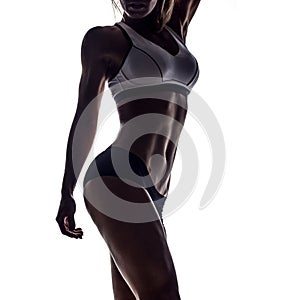 Silhouette of young fitness woman