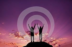 Silhouette,young girls and men celebrating victory