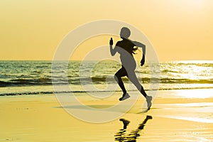 Silhouette of young happy and attractive African American runner woman exercising in running fitness sprint workout at beautiful b