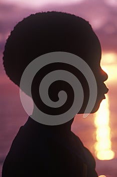 Silhouette of young Jamaican at sunset