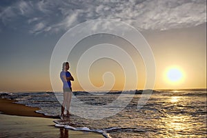 Silhouette of young man on beach