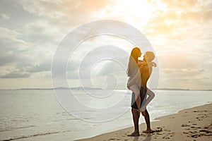Silhouette Young man and girl couple romantic embrace and kissing love leisure in celebration
