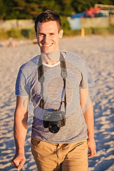 Silhouette of young photographer on the beach