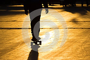 Silhouette of a young skateboarder