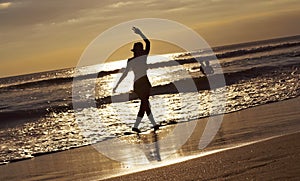 Silhouette young woman on beach