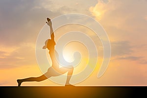 Silhouette of young woman with clipping path practicing yoga relaxing exercise at sunset, Freedom and relax concepts