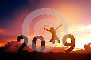 Silhouette young woman jumping to 2018 new year