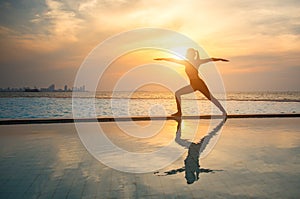 Silhouette young woman practicing yoga