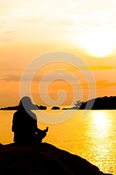 Silhouette of young woman standing at relax pose or freedom pose or chill pose