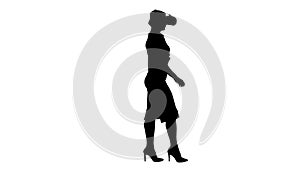 Silhouette Young woman wearing virtual reality device and walkin