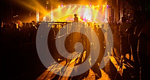 Silhouetted backlit Crowd at the night musical show