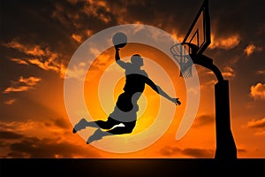 Silhouetted basketball player in mid air jump, poised for the slam dunk