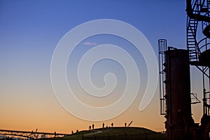 View of the gasworks buildings at sunset. photo