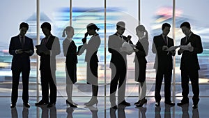 Silhouetted Business People in Modern Office Environment, Copy-space