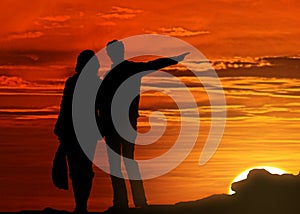 Silhouetted couple at sunset