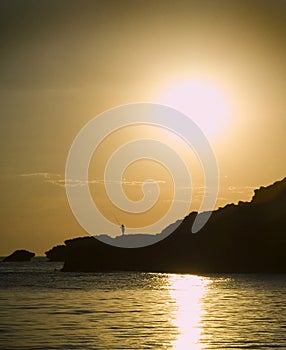 Silhouetted Fisherman