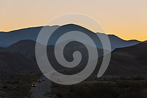 Silhouetted mountain range after sunset