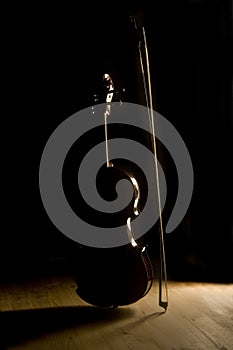 Silhouetted violin and bow