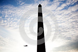 Silhouetted Washington Monument and Marine One Helicopter