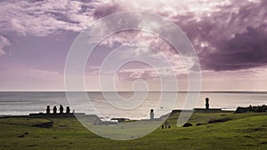 Silhouettes of Ahu Tahai moai in Hanga Roa, Easter Island during sunset