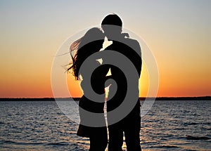 Silhouettes of amorous couple