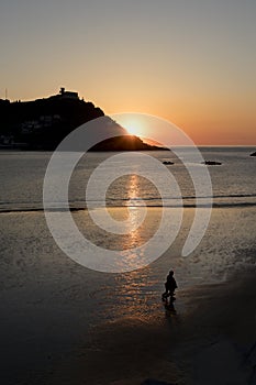 Silhouettes at the beach at sunset.