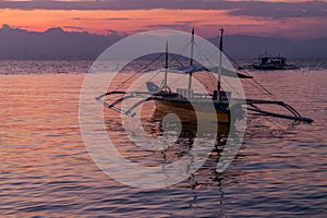 Silhouettes of boats in Moalboal, Cebu island, Philippin