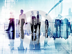 Silhouettes of Business People in Blurred Motion Walking photo