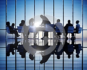 Silhouettes Of Business People In A Conference Room