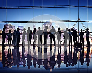 Silhouettes of Business People Working and Cityscape