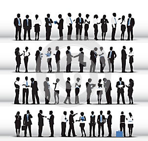 Silhouettes of Business People Working in a Row