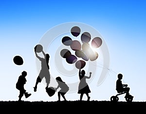 Silhouettes of Children Playing Balloons and Riding Bicycle