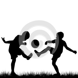 Silhouettes of children playing football