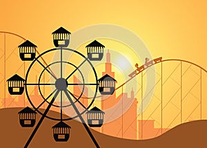 Silhouettes of a city and amusement park with the Ferris wheel .