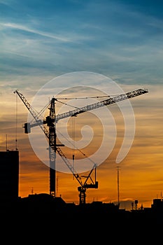 Silhouettes of construction crane