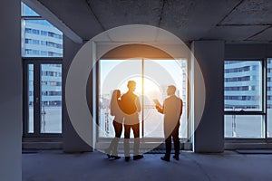 Silhouettes couple real estate agent apartment city